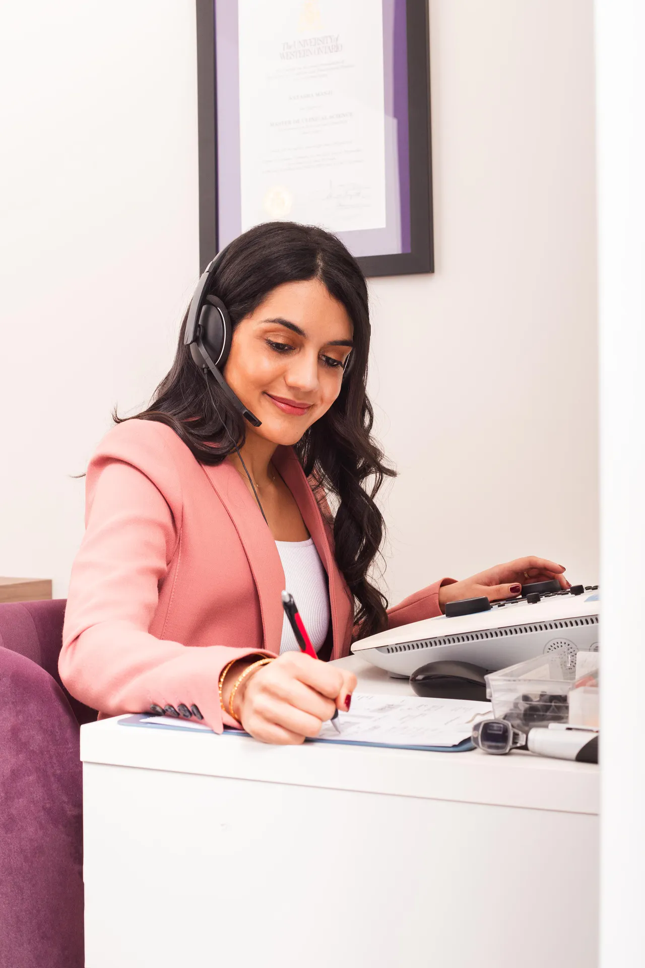 Natasha Manji at the clinic reception desk