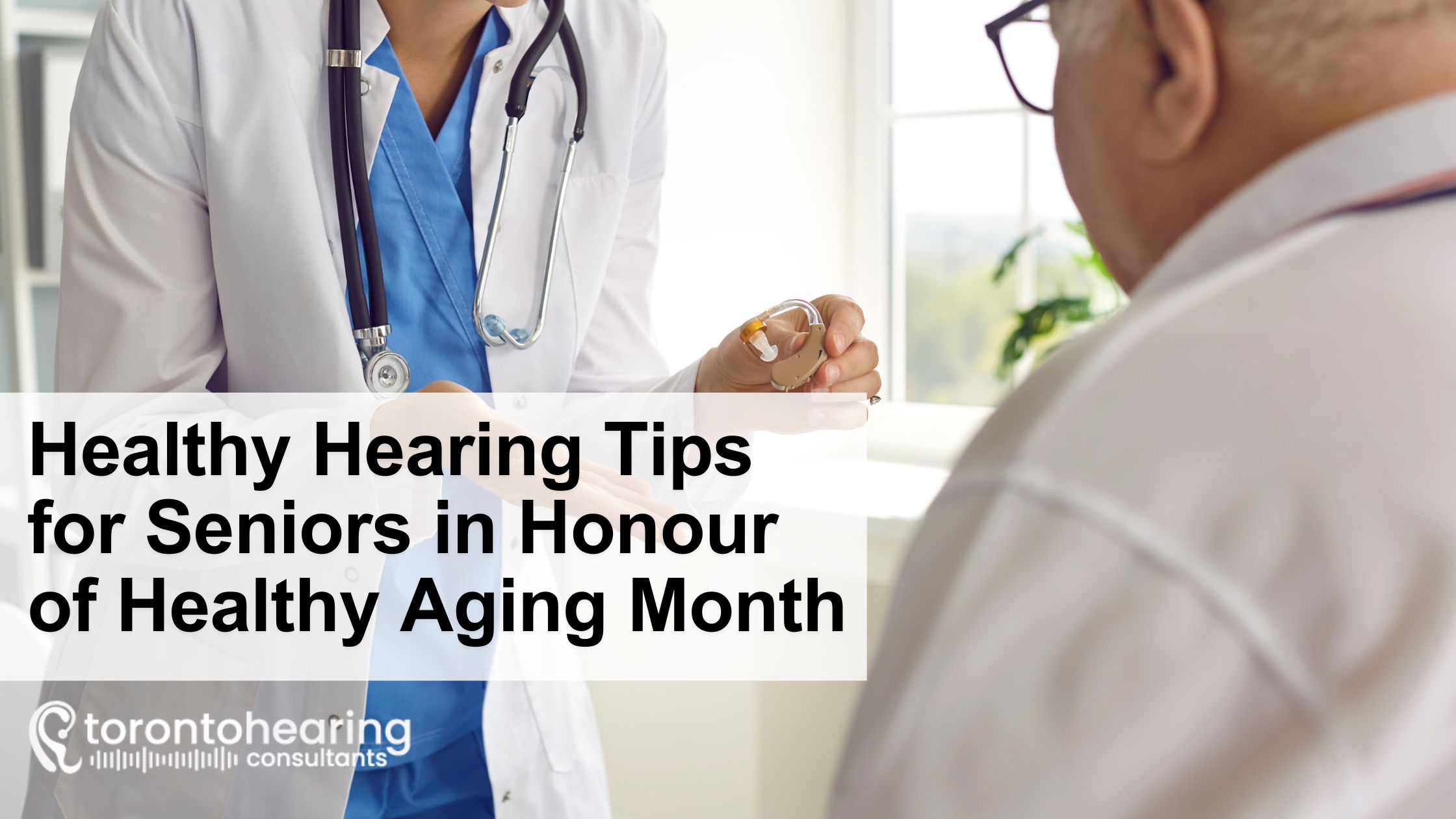 A hearing specialist from Toronto Hearing Consultants holds a hearing aid while advising a senior patient during a consultation.